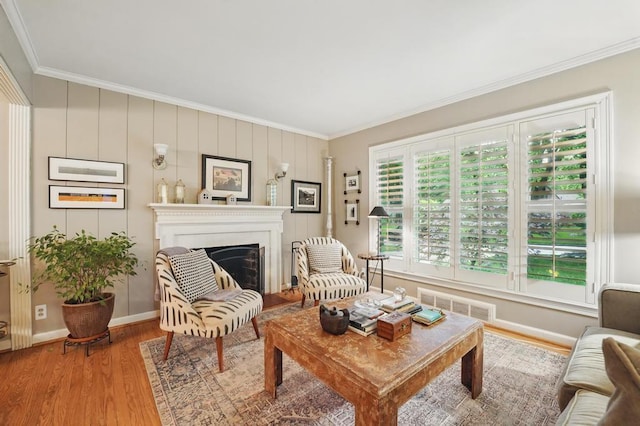 8604 Sagamore Rd, Leawood, KS 66206 - living area featuring ornamental molding, wood finished floors, and a fireplace
