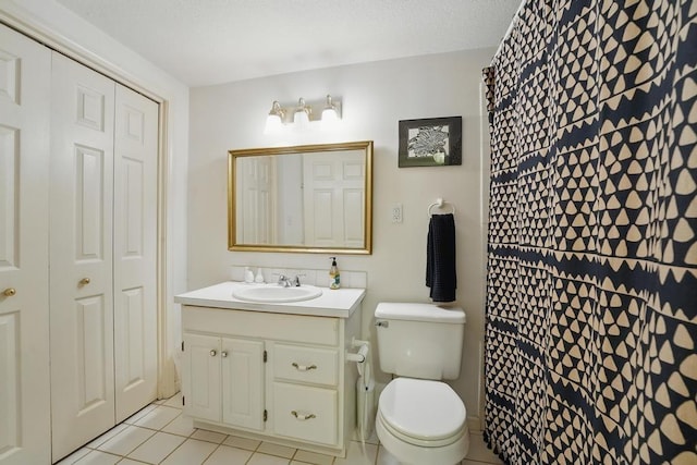 8604 Sagamore Rd, Leawood, KS 66206 - full bathroom featuring vanity, tile patterned flooring, and a closet