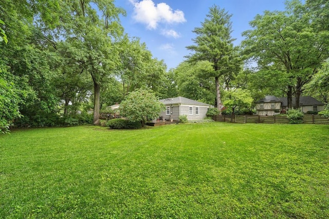 8604 Sagamore Rd, Leawood, KS 66206 - view of yard featuring a deck and view of wooded area