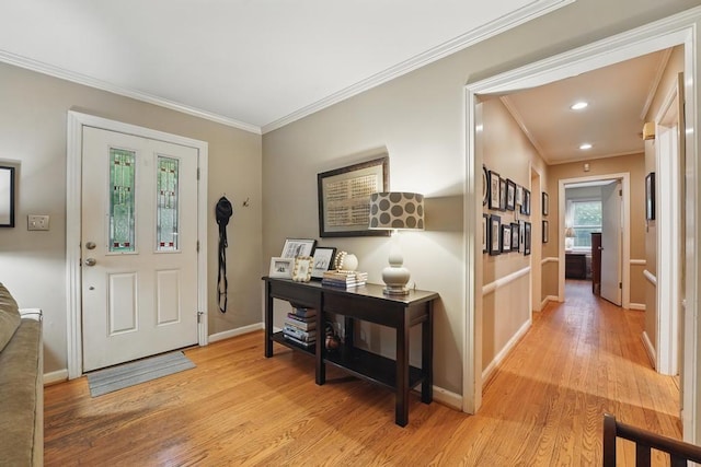 8604 Sagamore Rd, Leawood, KS 66206 - entrance foyer featuring light wood-style flooring, ornamental molding, and recessed lighting
