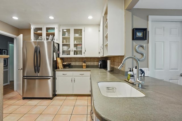 8604 Sagamore Rd, Leawood, KS 66206 - kitchen with freestanding refrigerator, open shelves, white cabinets, decorative backsplash, and glass insert cabinets
