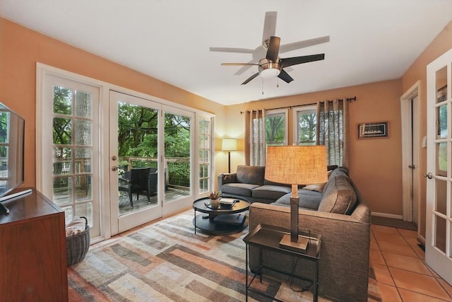 8604 Sagamore Rd, Leawood, KS 66206 - living area with healthy amount of natural light, a ceiling fan, and light tile patterned floors