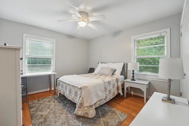 8604 Sagamore Rd, Leawood, KS 66206 - bedroom with wood finished floors and a ceiling fan