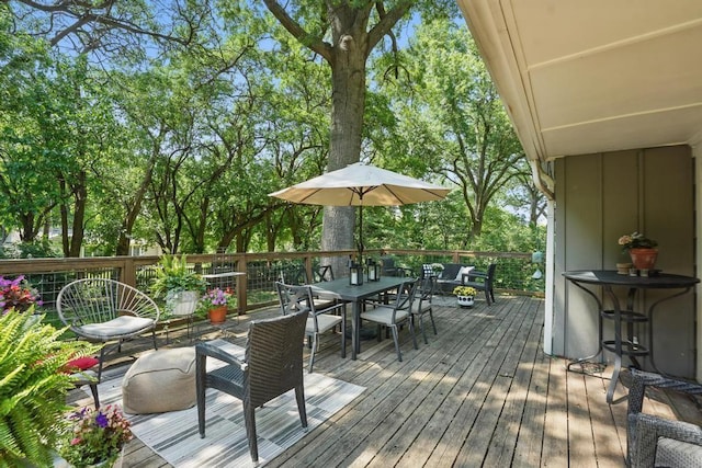 8604 Sagamore Rd, Leawood, KS 66206 - deck with outdoor dining area and view of scattered trees
