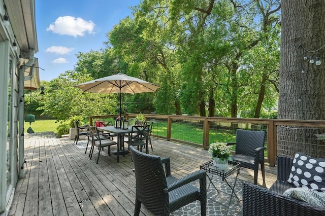 8604 Sagamore Rd, Leawood, KS 66206 - wooden terrace with outdoor dining space and a lawn