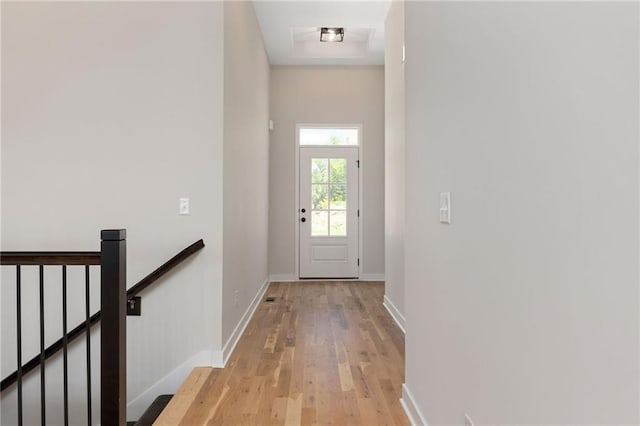 31501 W 86th Ct, De Soto, KS 66018 - doorway to outside featuring light wood-style floors and baseboards