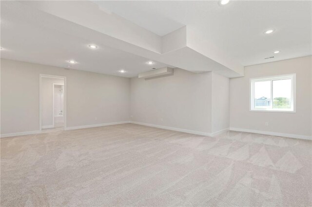 31501 W 86th Ct, De Soto, KS 66018 - below grade area featuring recessed lighting, light carpet, and an AC wall unit