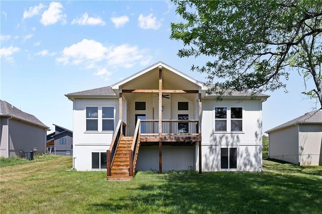 31501 W 86th Ct, De Soto, KS 66018 - back of house featuring stairs, a lawn, and a ceiling fan
