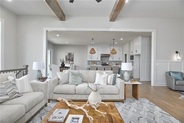 6113 Barth Rd, Shawnee, KS 66226 - living room featuring light wood-style flooring, beamed ceiling, and recessed lighting