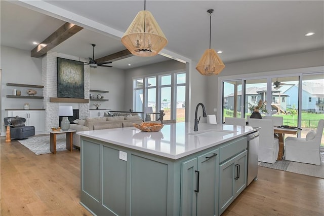 6113 Barth Rd, Shawnee, KS 66226 - kitchen with a sink, ceiling fan, stainless steel dishwasher, light wood-style floors, and beamed ceiling