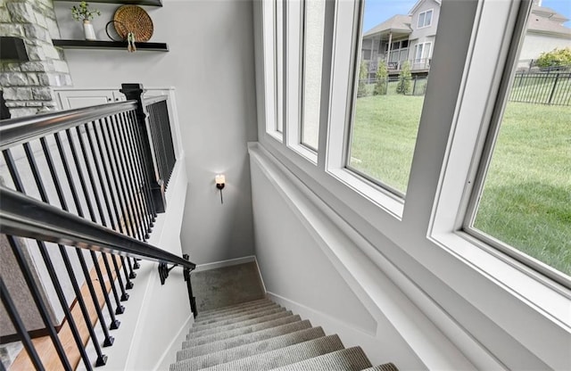 6113 Barth Rd, Shawnee, KS 66226 - staircase featuring plenty of natural light, baseboards, and carpet flooring