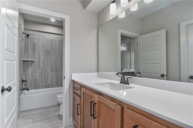 6113 Barth Rd, Shawnee, KS 66226 - bathroom with toilet, vanity, and tub / shower combination