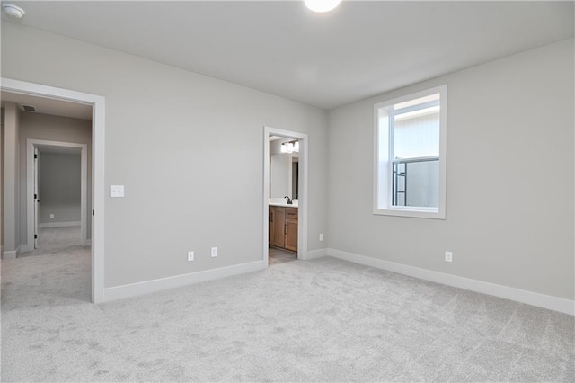 6113 Barth Rd, Shawnee, KS 66226 - unfurnished bedroom featuring light carpet and baseboards