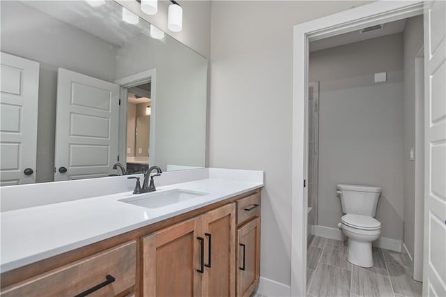 6113 Barth Rd, Shawnee, KS 66226 - bathroom featuring toilet, vanity, baseboards, and a tub to relax in