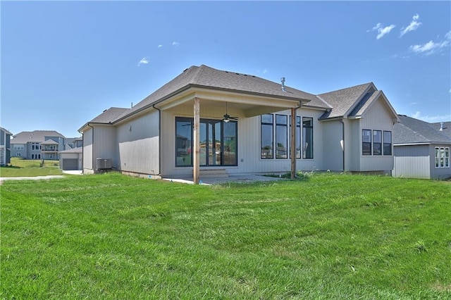 6113 Barth Rd, Shawnee, KS 66226 - back of house featuring a ceiling fan, a yard, central AC, and a patio area