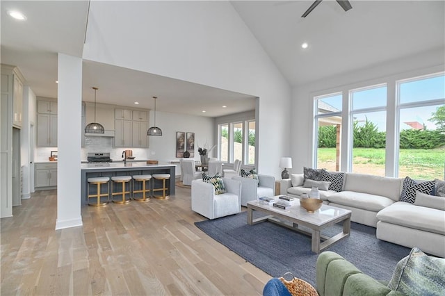 6039 Apache Dr, Shawnee, KS 66226 - living room with recessed lighting, high vaulted ceiling, and light wood-style floors