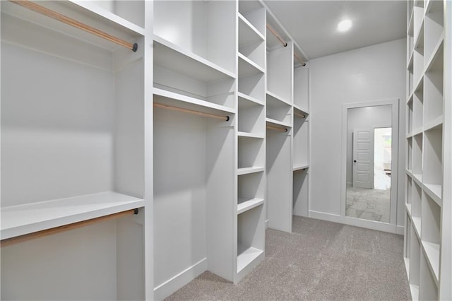 6039 Apache Dr, Shawnee, KS 66226 - walk in closet featuring light colored carpet