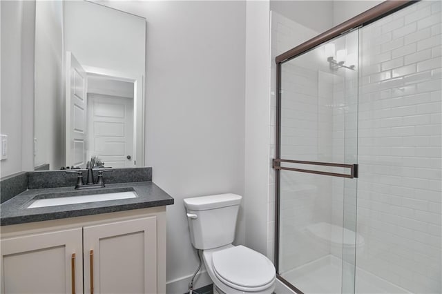 6039 Apache Dr, Shawnee, KS 66226 - bathroom with toilet, a stall shower, vanity, and baseboards