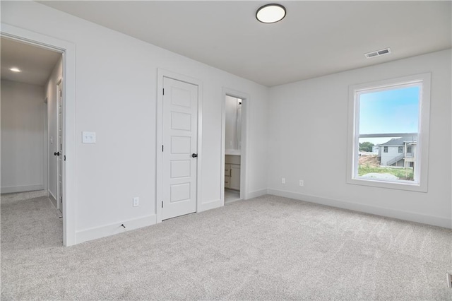 6039 Apache Dr, Shawnee, KS 66226 - unfurnished bedroom with carpet, baseboards, and ensuite bathroom