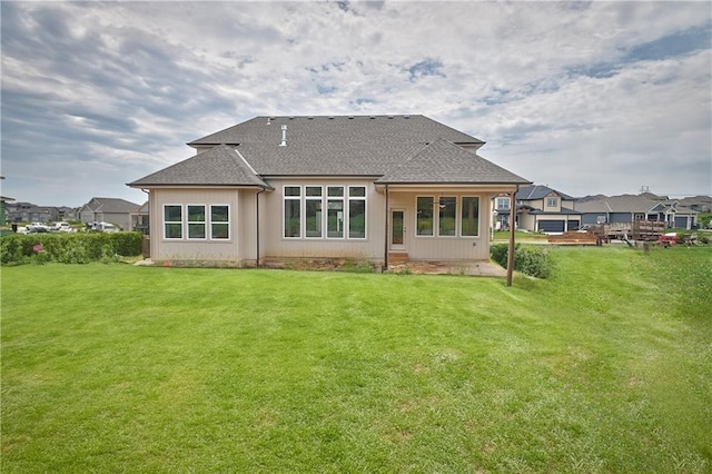 6039 Apache Dr, Shawnee, KS 66226 - rear view of house featuring roof with shingles and a lawn
