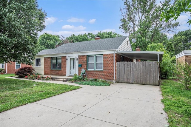 1307 W 30th St S, Independence, MO 64052 - view of front of home with concrete driveway, brick siding, a chimney, and a carport