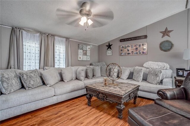 31965 Lakecrest Dr, Excelsior Springs, MO 64024 - living area with lofted ceiling, ceiling fan, a textured ceiling, and wood finished floors