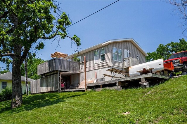 31965 Lakecrest Dr, Excelsior Springs, MO 64024 - back of property featuring a yard and a deck