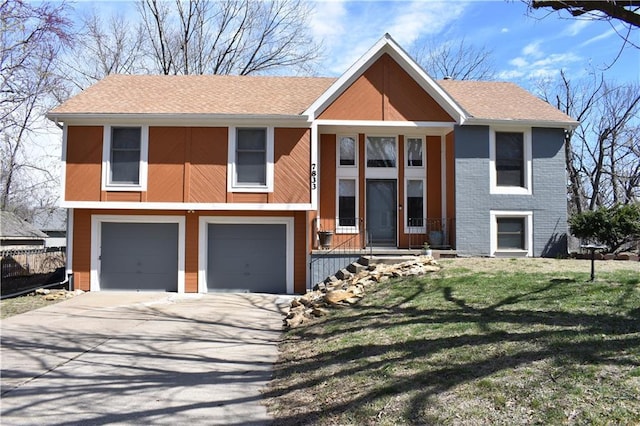 7833 Garnett St, Lenexa, KS 66214 - view of front of property featuring an attached garage, a front lawn, driveway, and roof with shingles