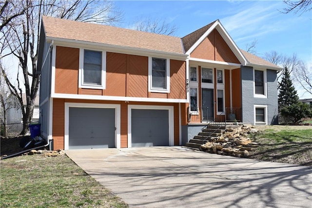 7833 Garnett St, Lenexa, KS 66214 - view of front of house featuring an attached garage and driveway