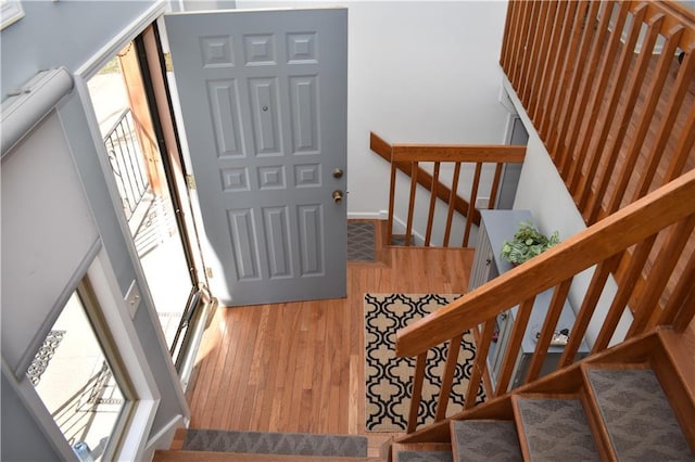 7833 Garnett St, Lenexa, KS 66214 - stairs with wood finished floors and baseboards