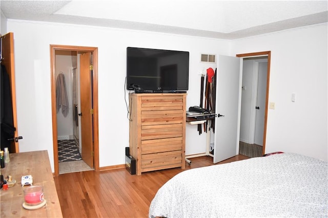 7833 Garnett St, Lenexa, KS 66214 - bedroom featuring light wood finished floors