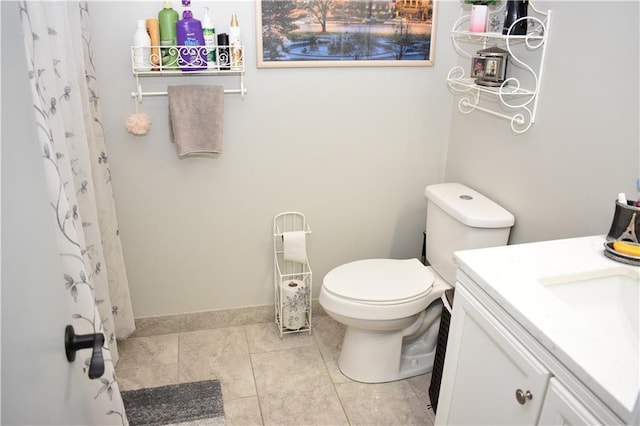 7833 Garnett St, Lenexa, KS 66214 - bathroom featuring vanity, toilet, a shower with curtain, and tile patterned floors