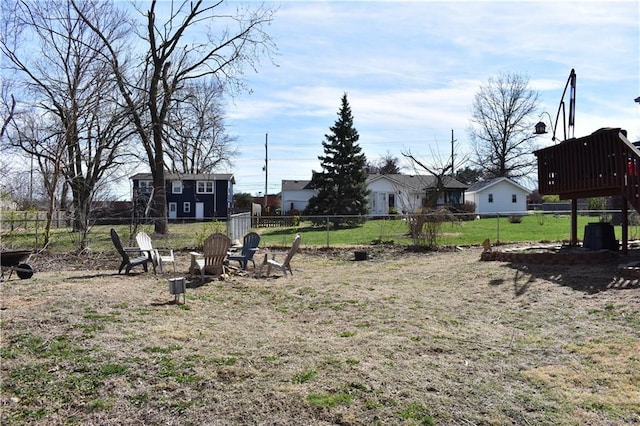 7833 Garnett St, Lenexa, KS 66214 - view of yard featuring a fire pit