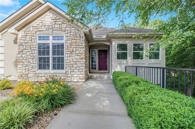 812 E 110th Ter, Kansas City, MO 64131 - view of front of house featuring stone siding and a shingled roof