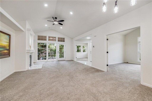 812 E 110th Ter, Kansas City, MO 64131 - unfurnished living room with a ceiling fan, light colored carpet, vaulted ceiling, recessed lighting, and a fireplace