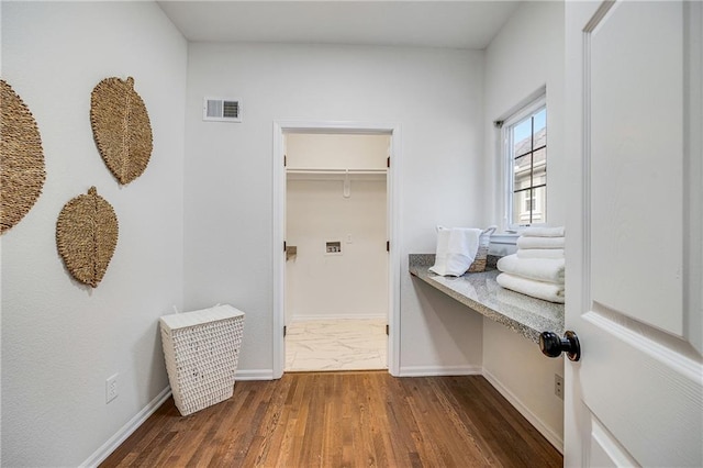812 E 110th Ter, Kansas City, MO 64131 - laundry room with baseboards and dark wood-style flooring