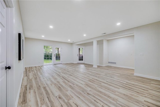 812 E 110th Ter, Kansas City, MO 64131 - unfurnished living room featuring light wood-style flooring, recessed lighting, and french doors