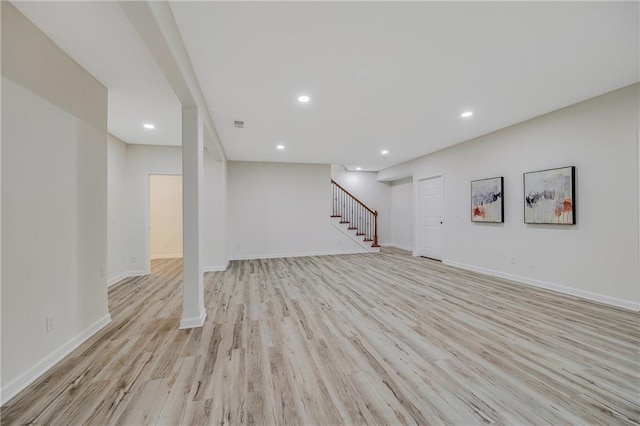 812 E 110th Ter, Kansas City, MO 64131 - finished below grade area with stairway, light wood-type flooring, and recessed lighting