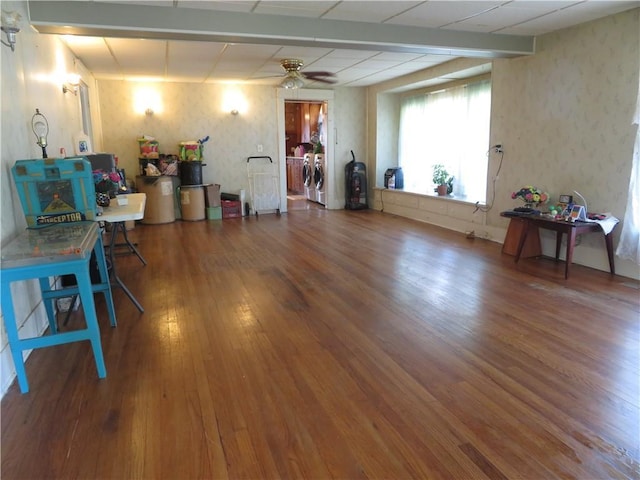 201 E Ottawa St, Paola, KS 66071 - miscellaneous room featuring wood finished floors, independent washer and dryer, ceiling fan, and wallpapered walls
