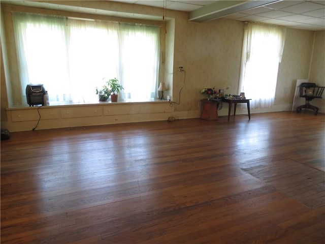 201 E Ottawa St, Paola, KS 66071 - empty room featuring hardwood / wood-style flooring and wallpapered walls