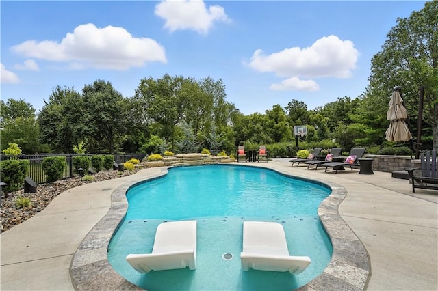 9905 W 144th St, Overland Park, KS 66221 - view of swimming pool with a patio area, view of scattered trees, and a diving board
