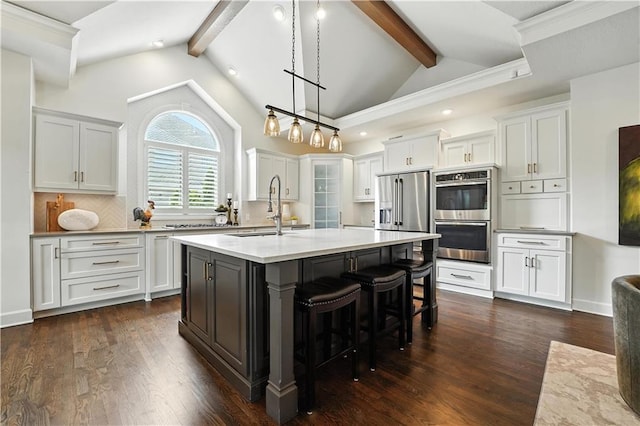 9905 W 144th St, Overland Park, KS 66221 - kitchen with stainless steel appliances, white cabinets, light countertops, and recessed lighting