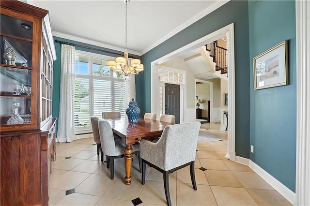 9905 W 144th St, Overland Park, KS 66221 - dining space featuring a chandelier, light tile patterned floors, ornamental molding, and wainscoting