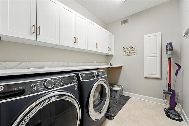 9905 W 144th St, Overland Park, KS 66221 - laundry area featuring washer and dryer, cabinet space, and tile patterned floors