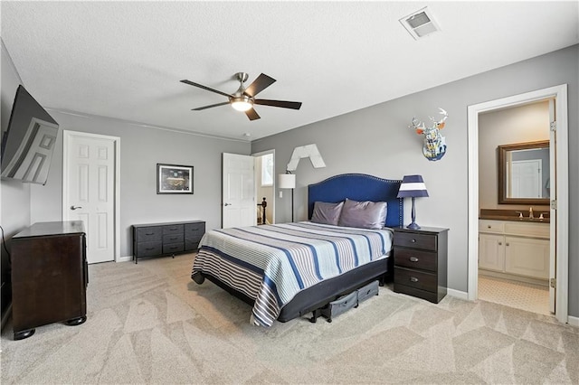 9905 W 144th St, Overland Park, KS 66221 - bedroom featuring light carpet, ensuite bath, ceiling fan, and a textured ceiling