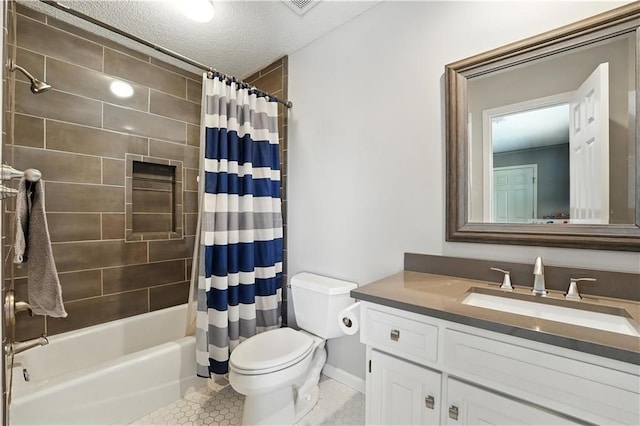 9905 W 144th St, Overland Park, KS 66221 - bathroom featuring vanity, shower / bath combo with shower curtain, tile patterned flooring, and a textured ceiling