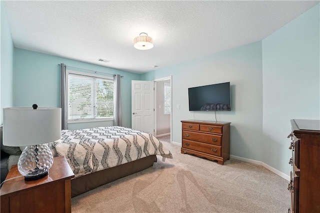 9905 W 144th St, Overland Park, KS 66221 - bedroom with carpet floors and a textured ceiling