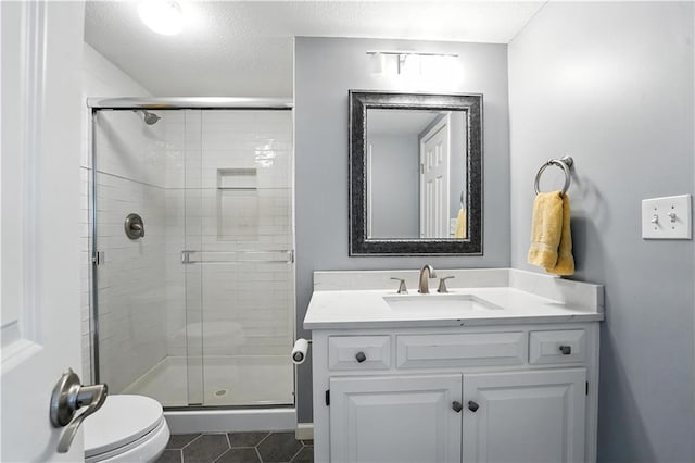 9905 W 144th St, Overland Park, KS 66221 - full bath with tile patterned flooring, vanity, a stall shower, and a textured ceiling