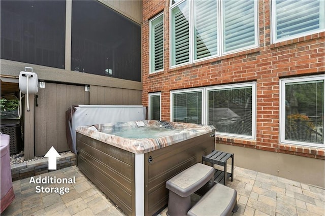 9905 W 144th St, Overland Park, KS 66221 - view of patio featuring a hot tub