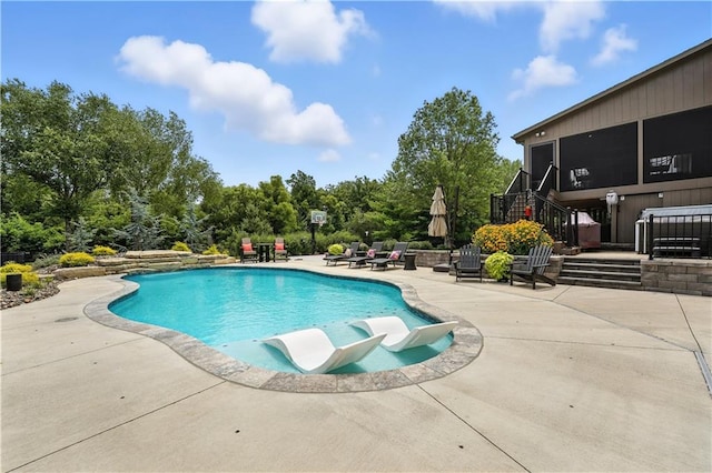 9905 W 144th St, Overland Park, KS 66221 - outdoor pool with a patio, view of scattered trees, and stairway
